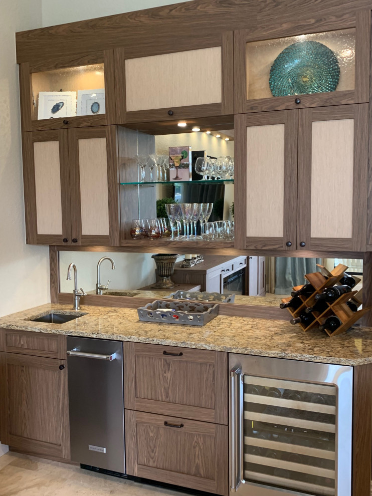 Large single-wall wet bar in Miami with an undermount sink, shaker cabinets, brown cabinets, quartzite benchtops, mirror splashback, marble floors, beige floor and brown benchtop.