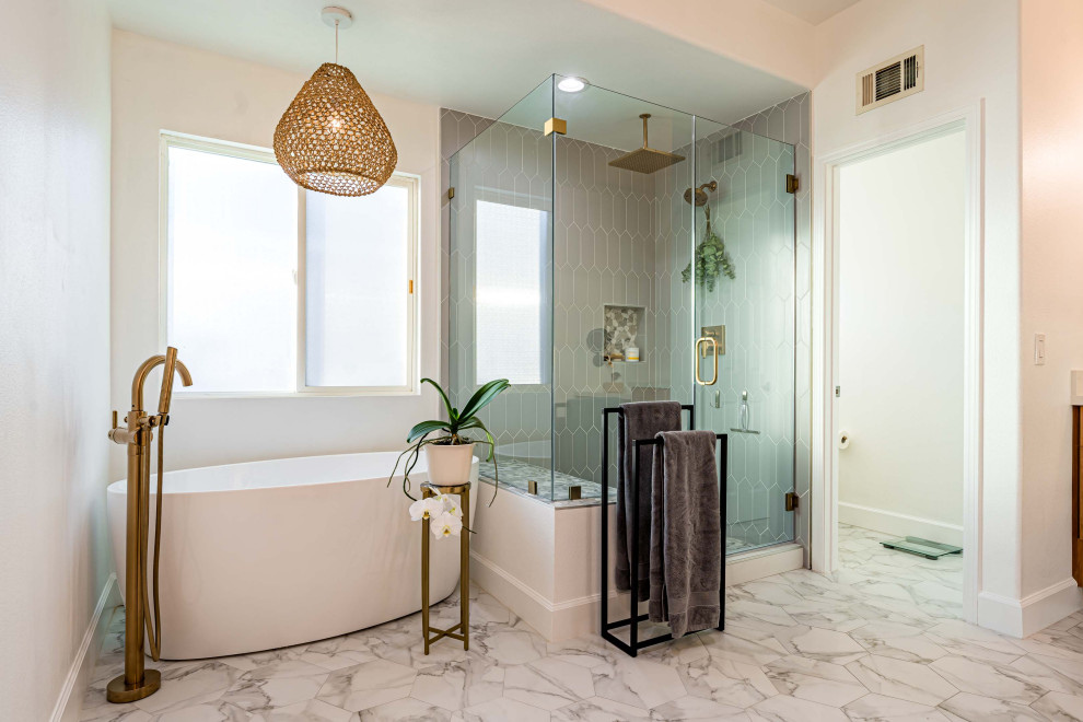 Large transitional master bathroom in Orange County with a built-in vanity, flat-panel cabinets, medium wood cabinets, a freestanding tub, a corner shower, a one-piece toilet, gray tile, porcelain tile, white walls, marble floors, an undermount sink, engineered quartz benchtops, multi-coloured floor, a hinged shower door, white benchtops, a shower seat, a single vanity, wallpaper and wallpaper.