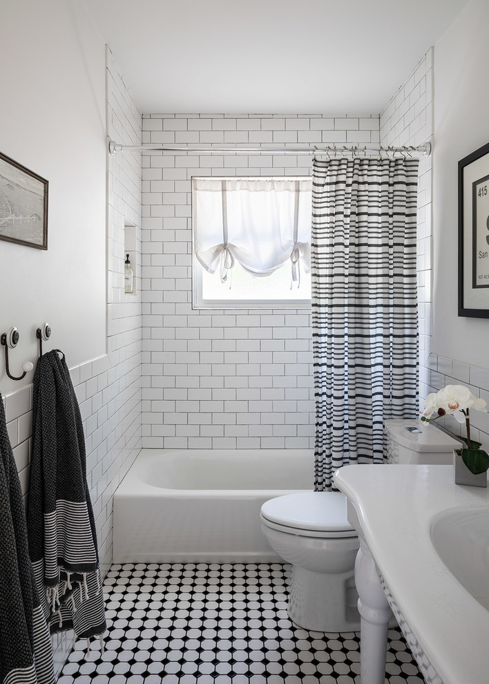 Design ideas for a mid-sized transitional kids bathroom in Boise with open cabinets, white cabinets, a drop-in tub, a two-piece toilet, white tile, subway tile, white walls, mosaic tile floors and white floor.