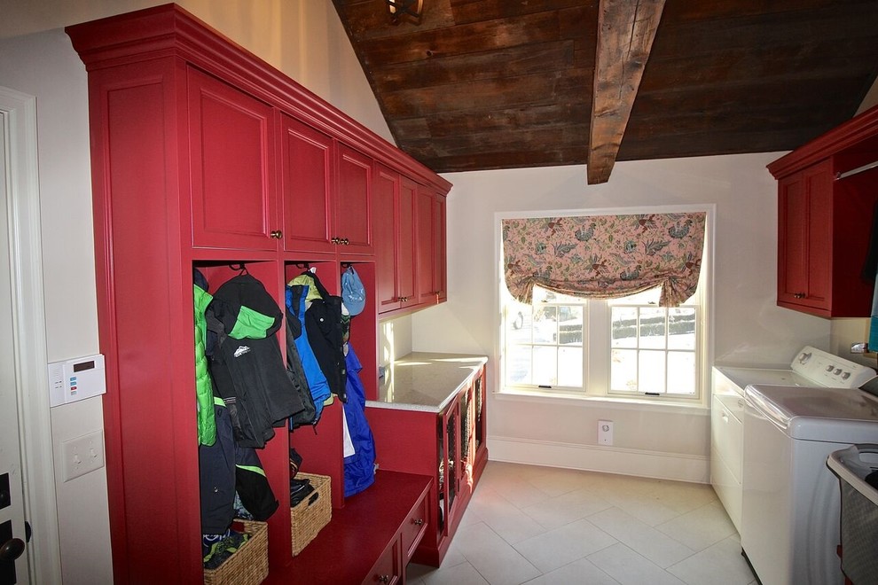Photo of a laundry room in Omaha with red cabinets and white walls.