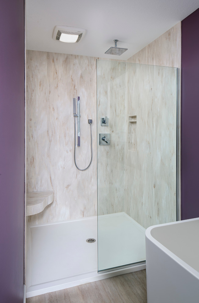 This is an example of a large contemporary master bathroom in Other with shaker cabinets, grey cabinets, a freestanding tub, a curbless shower, a one-piece toilet, purple walls, an undermount sink, granite benchtops, beige tile, marble, light hardwood floors, beige floor and an open shower.