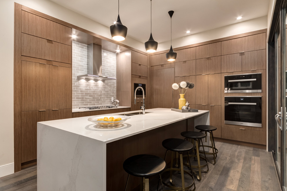Example of a transitional kitchen design in Calgary