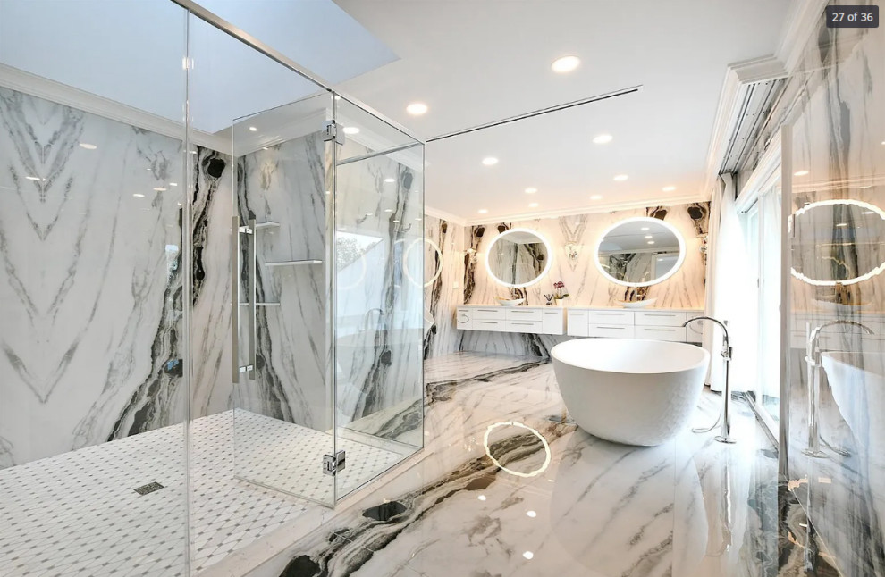Design ideas for a large modern master bathroom in New York with flat-panel cabinets, white cabinets, a freestanding tub, a double shower, a bidet, black and white tile, marble, black walls, marble floors, a vessel sink, marble benchtops, black floor, a hinged shower door, white benchtops, an enclosed toilet, a double vanity and a floating vanity.