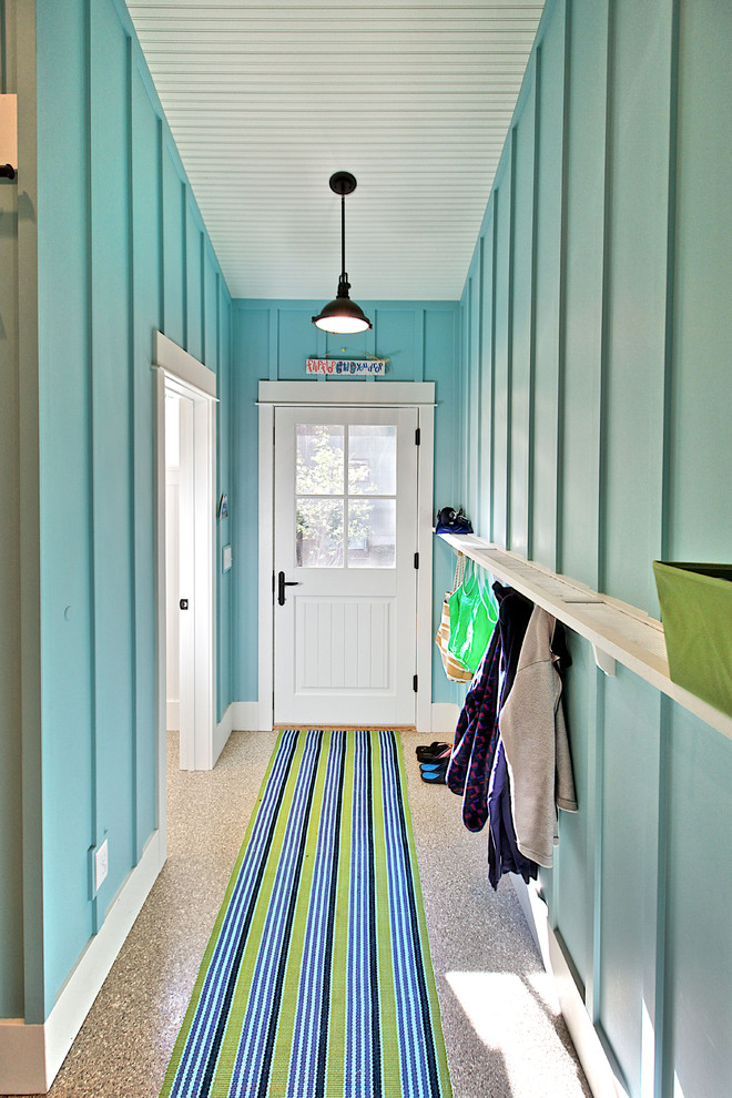 This is an example of a beach style entryway in Other with a white front door.