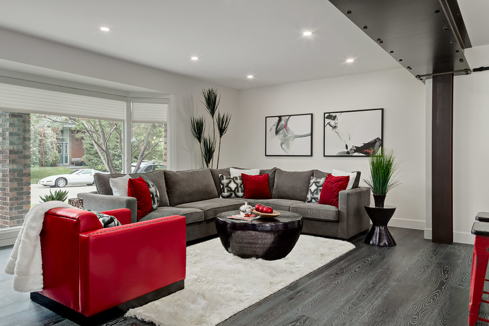 Photo of a large contemporary open concept living room in Calgary with white walls and dark hardwood floors.