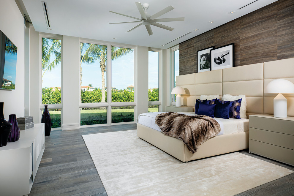 Large contemporary master bedroom in Other with white walls, dark hardwood floors and brown floor.