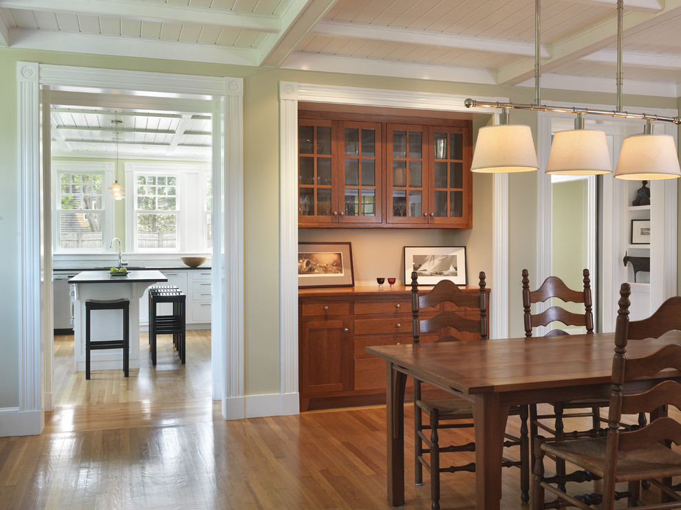 Photo of a traditional dining room in Providence with beige walls and dark hardwood floors.