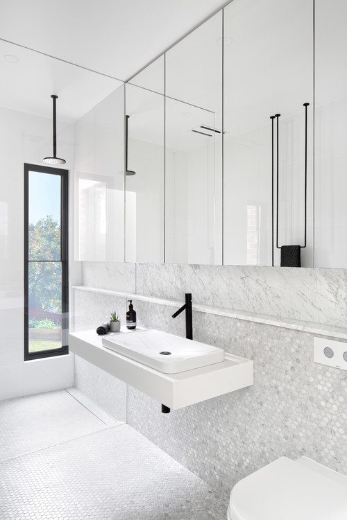 Marble Minimalism: Minimalist Bathroom Design with Black Accents