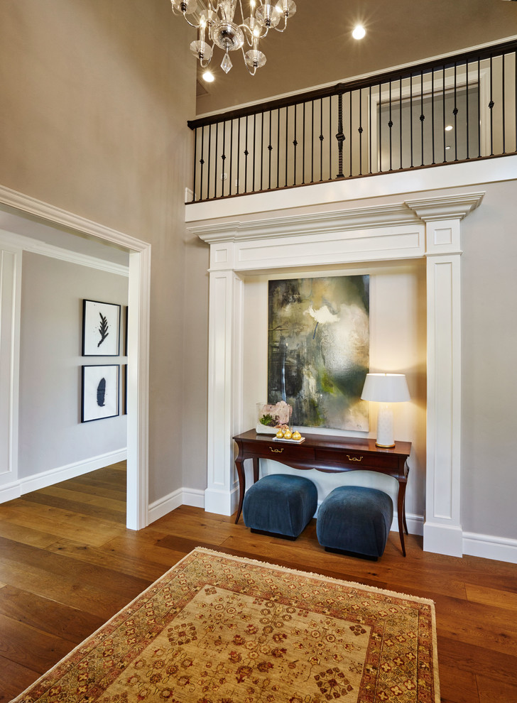 Large traditional foyer in Portland with grey walls, medium hardwood floors and a single front door.