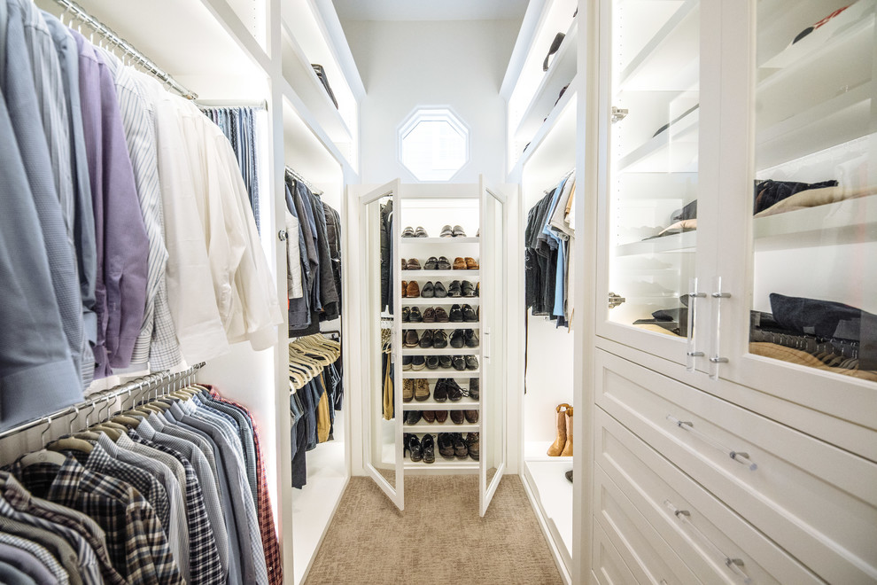 Design ideas for a large traditional gender-neutral walk-in wardrobe in Dallas with white cabinets, carpet, recessed-panel cabinets and brown floor.