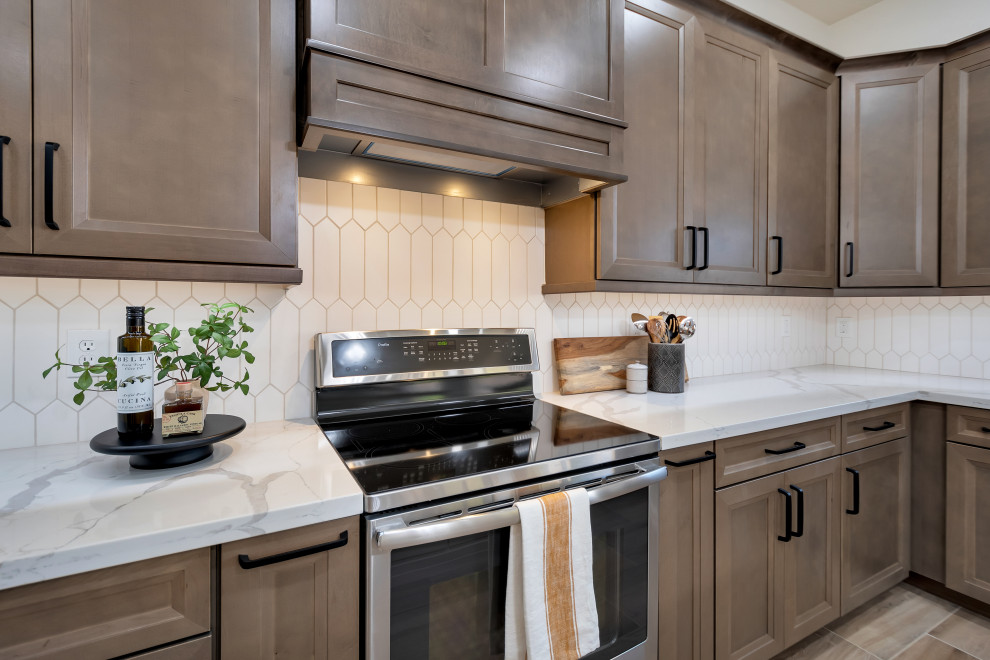 Eat-in kitchen - mid-sized transitional u-shaped ceramic tile and brown floor eat-in kitchen idea in Phoenix with beaded inset cabinets, brown cabinets, quartzite countertops, white backsplash, ceramic backsplash, an island and white countertops