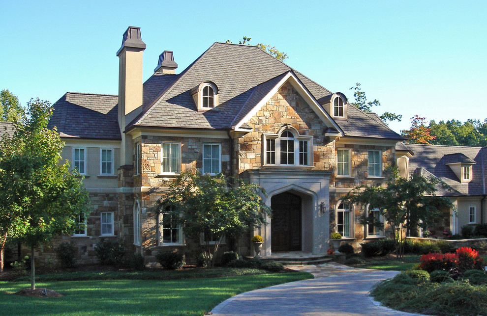 Design ideas for a mid-sized traditional three-storey exterior in Other.