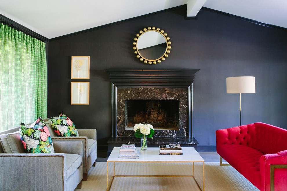Southill - We honed the existing marble at the fireplace surround and painted the walls a dark color to blend with the fireplace. We brought in color with a velvet sofa, green and white draperies and floral pillows on the chairs.