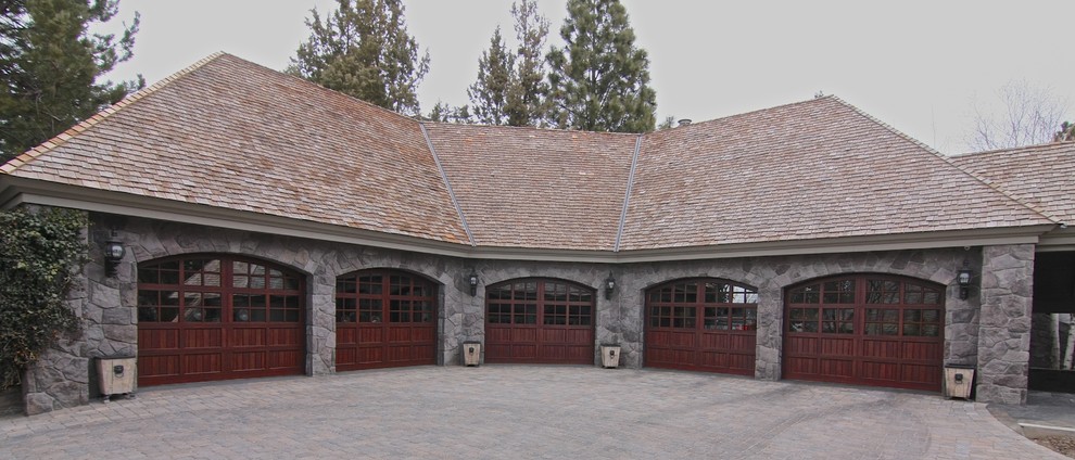 Design ideas for a mid-sized country attached four-car garage in Seattle.