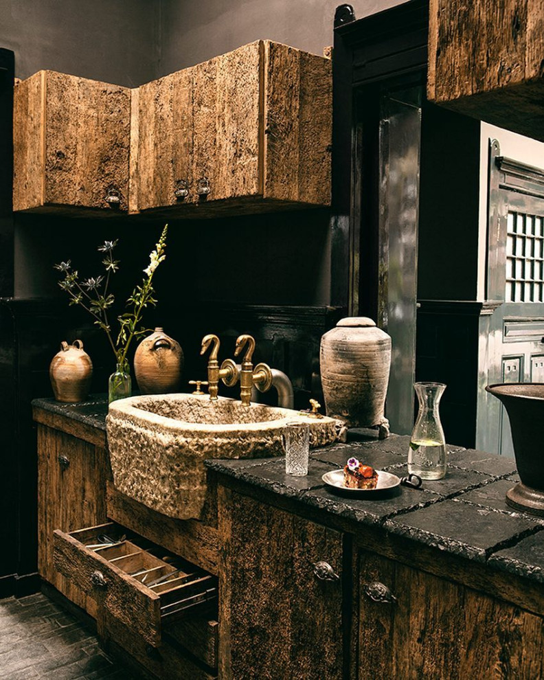 Inspiration for a country bathroom in Los Angeles with limestone floors, a trough sink, limestone benchtops and a single vanity.