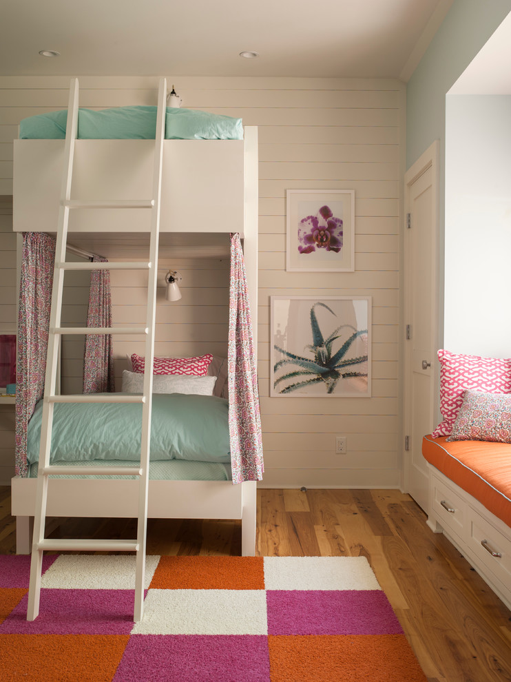 Example of a bedroom and large transitional guest and girl medium tone wood floor kids' bedroom design in Boston with white walls and no fireplace