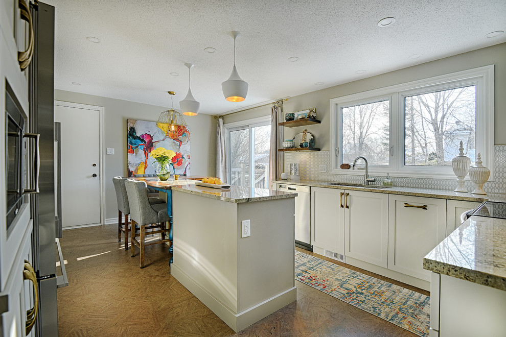 Mid-sized transitional cork floor enclosed kitchen photo in Ottawa with an undermount sink, shaker cabinets, white cabinets, granite countertops, gray backsplash, ceramic backsplash, stainless steel appliances and an island