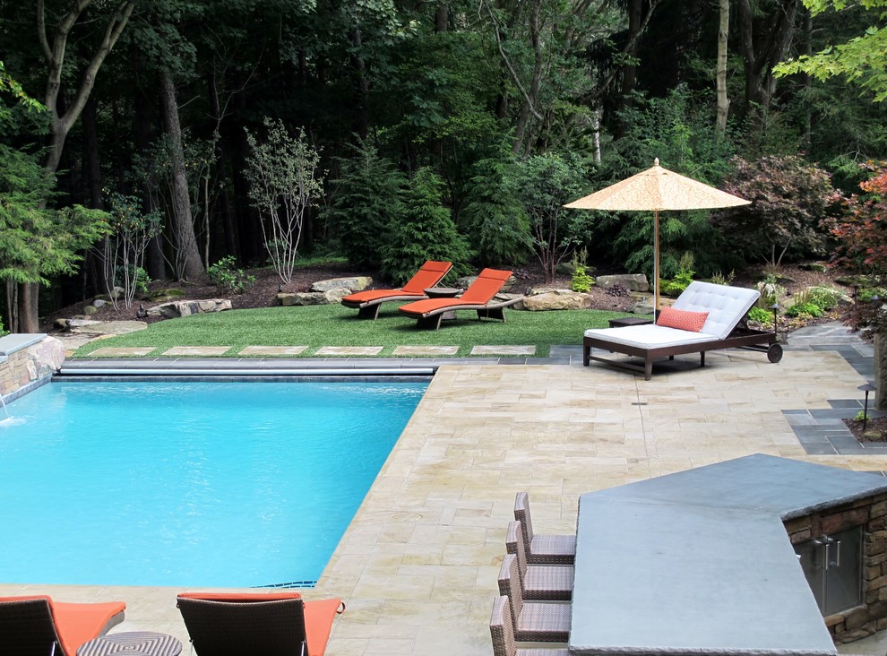 Inspiration for a contemporary pool in Cleveland with brick pavers.