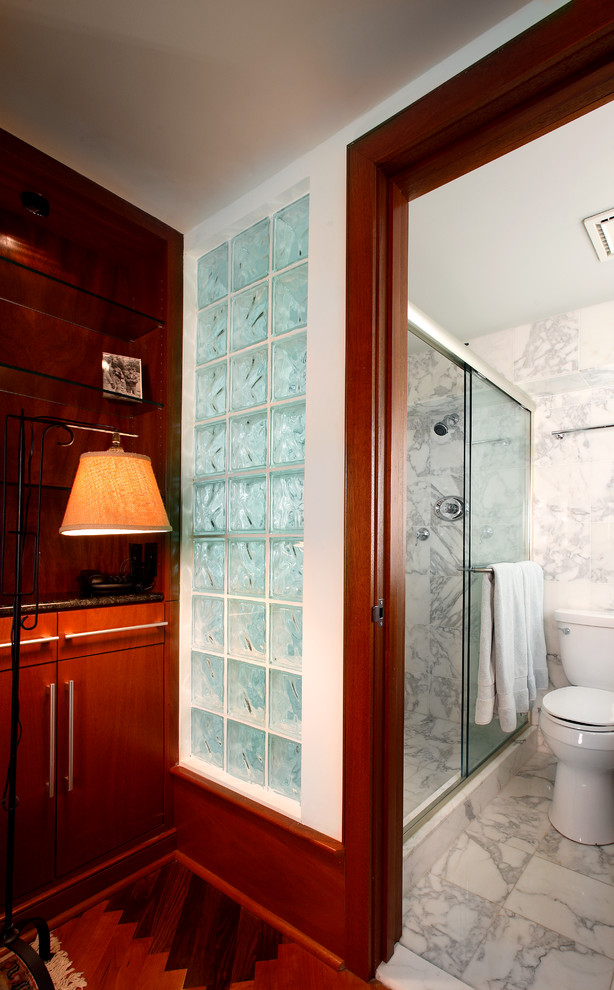 The Calacatta Marble Bath opens to the Bedroom loft through a Glass Block wall