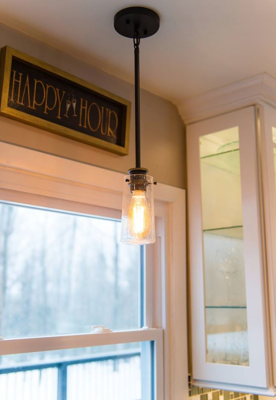 Mid-sized transitional galley medium tone wood floor and brown floor eat-in kitchen photo with an undermount sink, shaker cabinets, white cabinets, marble countertops, metallic backsplash, mosaic tile backsplash, stainless steel appliances and a peninsula