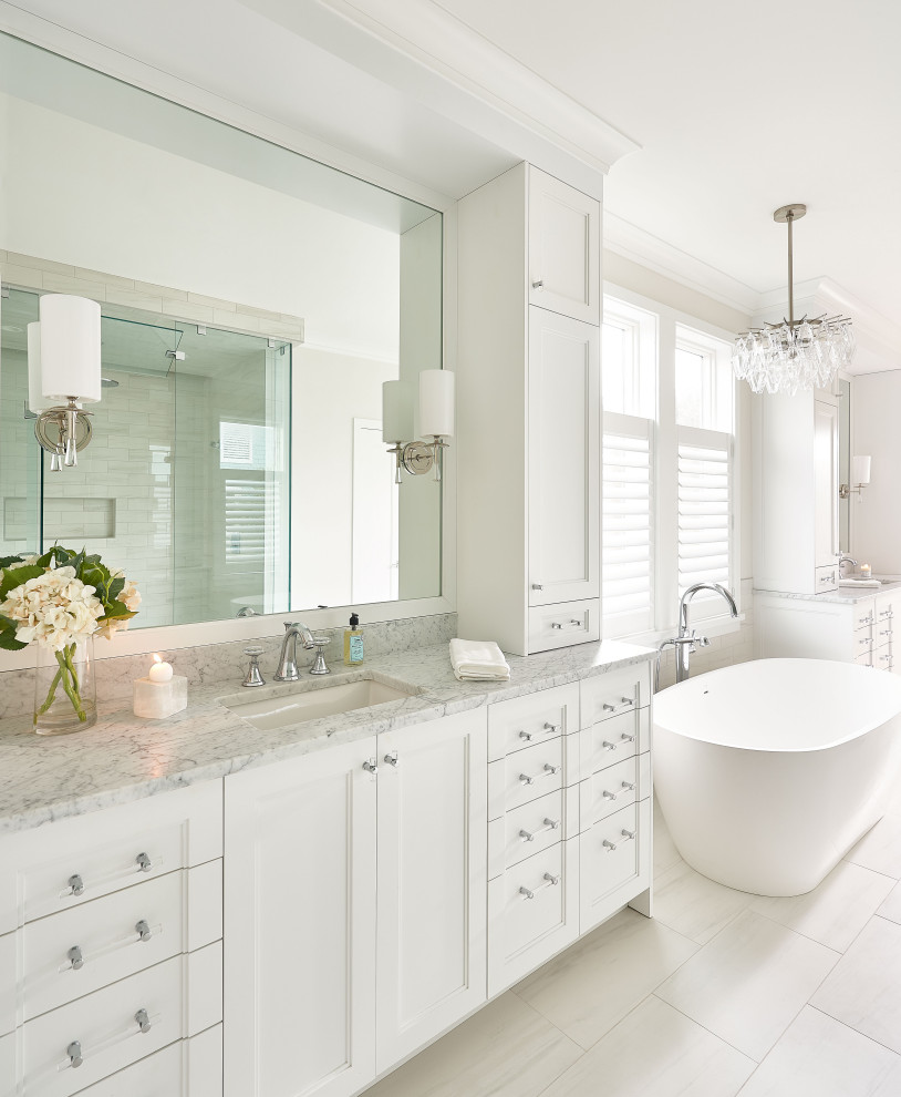 Inspiration for a large transitional master bathroom in Wilmington with marble benchtops and a built-in vanity.