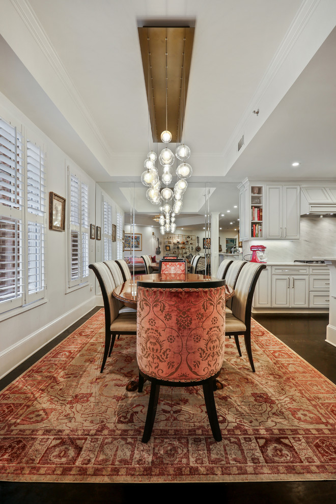 Design ideas for a mid-sized eclectic open plan dining in Atlanta with white walls, dark hardwood floors and black floor.