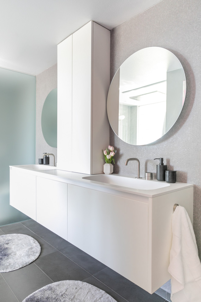 Inspiration for a mid-sized contemporary master marble floor and double-sink wet room remodel in Santa Barbara with flat-panel cabinets, white cabinets, a one-piece toilet, multicolored walls, an undermount sink, quartz countertops, a hinged shower door, turquoise countertops and a built-in vanity