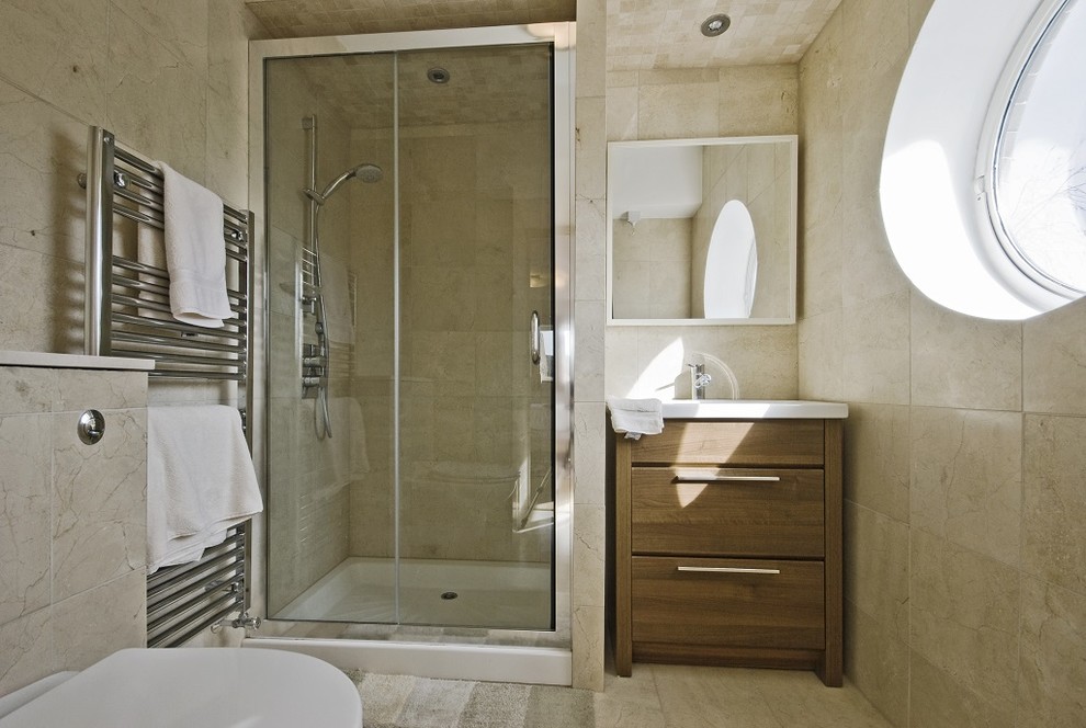 This is an example of a small contemporary kids bathroom in Los Angeles with furniture-like cabinets, medium wood cabinets, a corner shower, a one-piece toilet, beige tile, ceramic tile, white walls, terra-cotta floors, a drop-in sink and quartzite benchtops.