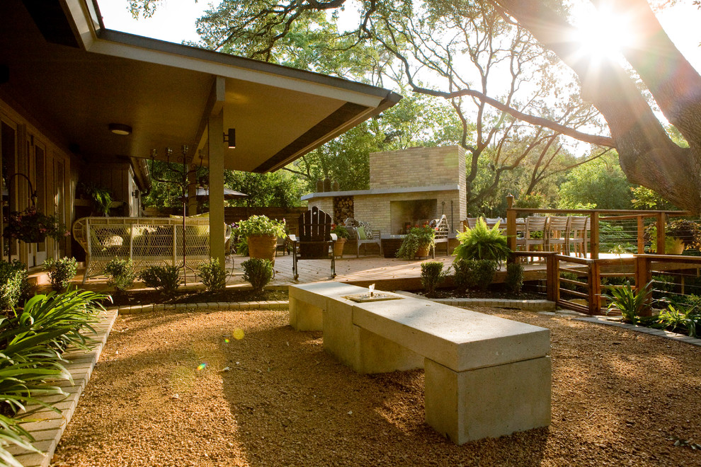 Large midcentury one-storey beige exterior in Austin with wood siding and a gable roof.