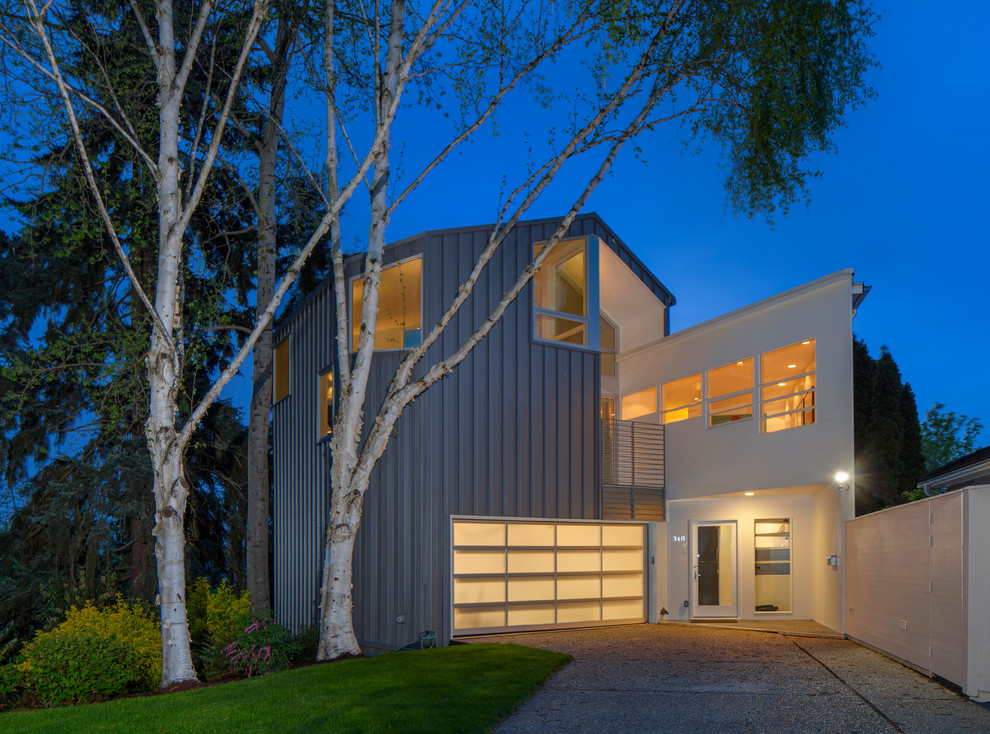 Photo of a large contemporary split-level exterior in Seattle with metal siding.