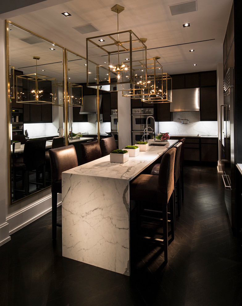 This is an example of a large modern kitchen/dining combo in New York with dark hardwood floors.