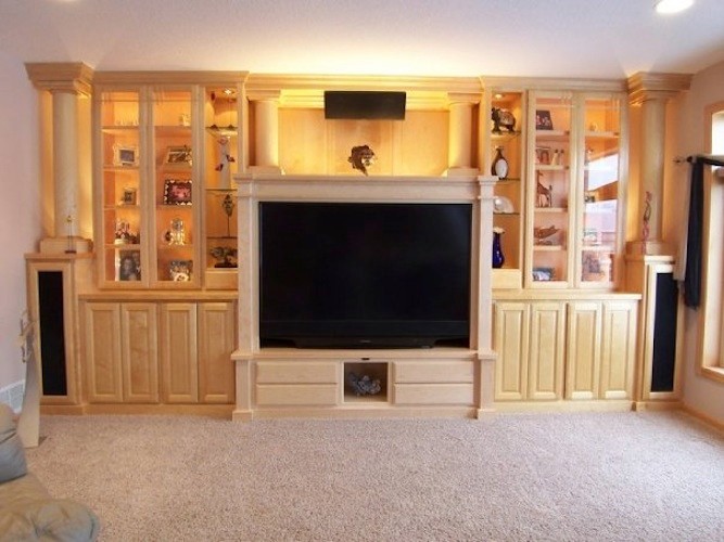 Inspiration for a large asian enclosed home theatre in Minneapolis with a built-in media wall.