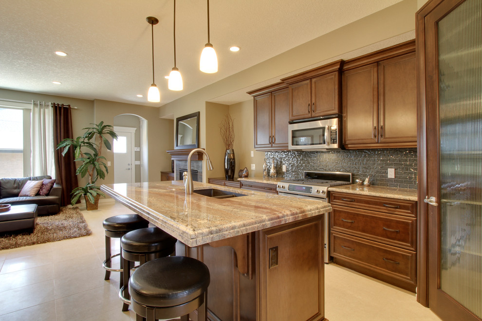 Example of a transitional kitchen design in Calgary