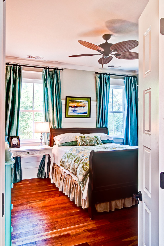 Example of a farmhouse bedroom design in Charleston with green walls