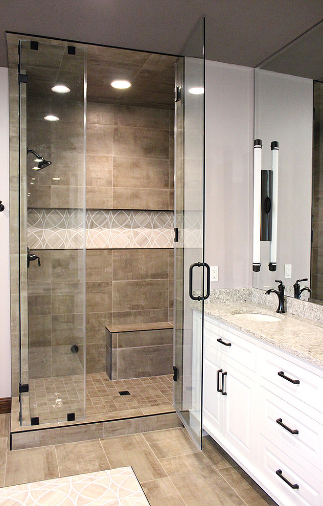 Large traditional master bathroom in Other with raised-panel cabinets, white cabinets, a freestanding tub, a double shower, beige tile, porcelain tile, purple walls, marble floors, an undermount sink, engineered quartz benchtops, beige floor, a hinged shower door and beige benchtops.