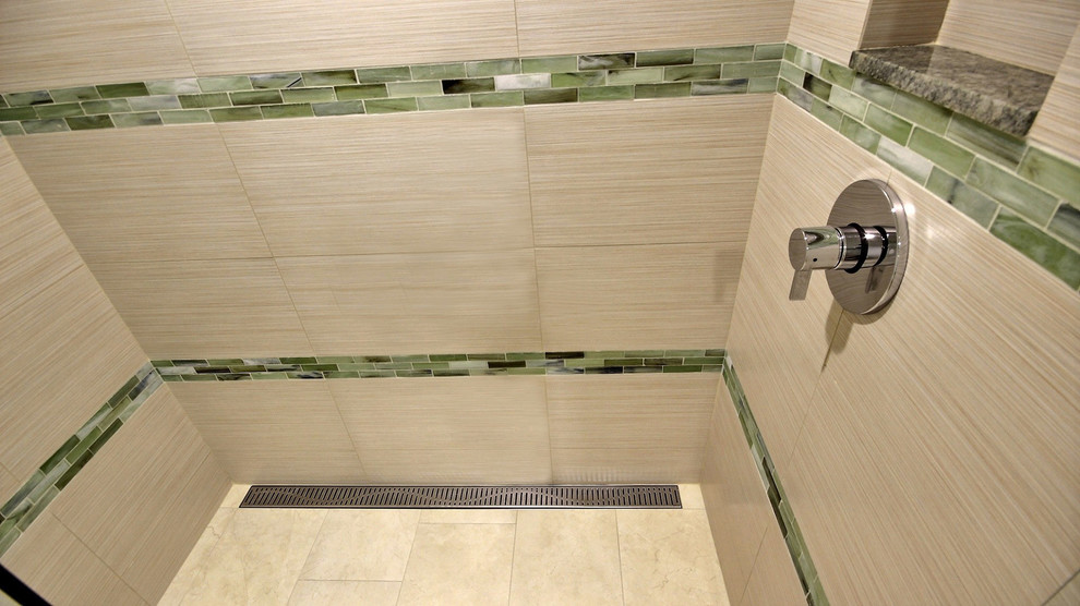 This is an example of a mid-sized transitional 3/4 bathroom in Hawaii with flat-panel cabinets, medium wood cabinets, an alcove shower, green tile, porcelain tile, porcelain floors, an undermount sink and granite benchtops.