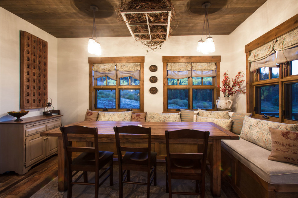Dining room - rustic dining room idea in Denver