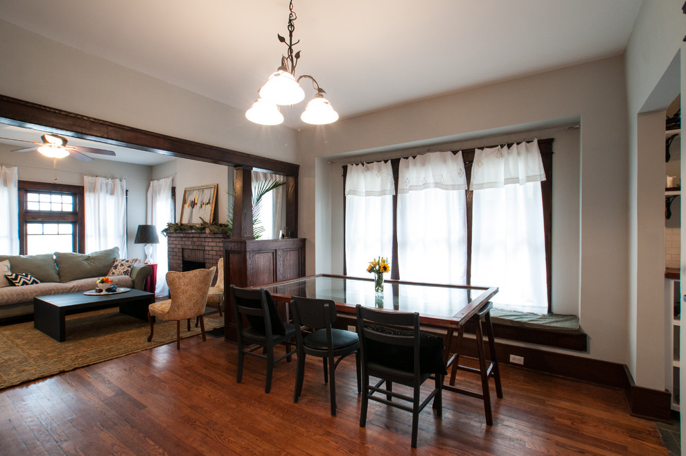 Medium sized classic dining room in Other with grey walls and medium hardwood flooring.
