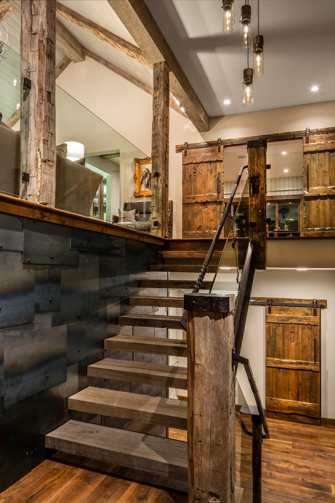 Small mountain style wooden straight open and metal railing staircase photo