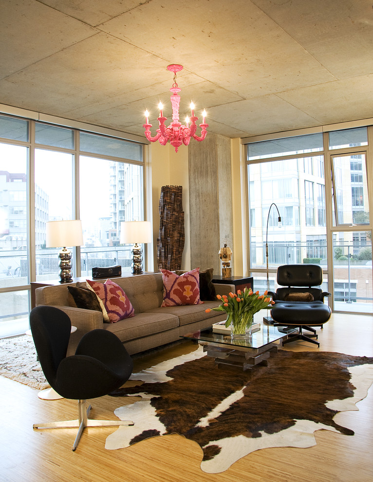 This is an example of an industrial open concept living room in Seattle with beige walls.