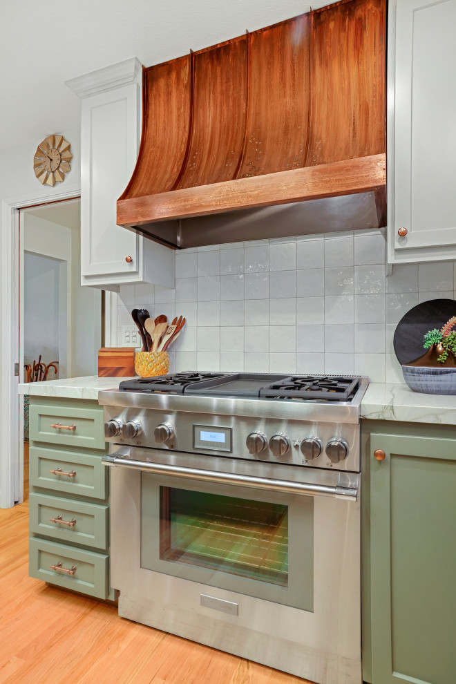 Inspiration for a modern eat-in kitchen in Sacramento with an undermount sink, shaker cabinets, green cabinets, quartzite benchtops, white splashback, ceramic splashback, panelled appliances, with island and grey benchtop.