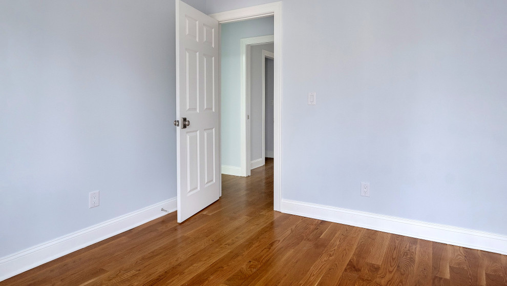 Bedroom with Hardwood Floors and White Trim