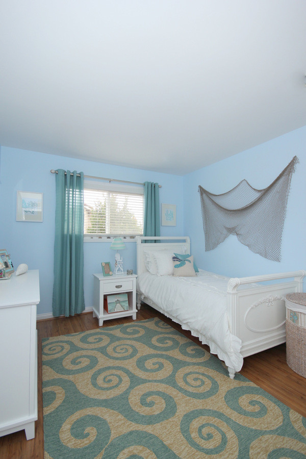 This is an example of a beach style kids' room in Los Angeles.