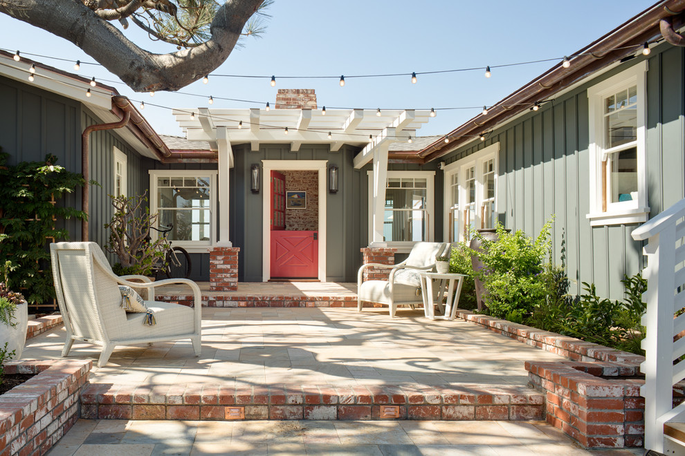 Inspiration for a beach style entryway in San Diego with a dutch front door and a red front door.