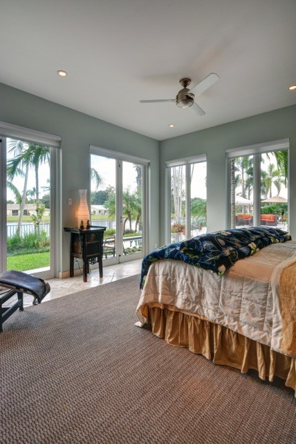 Example of a transitional bedroom design in Miami