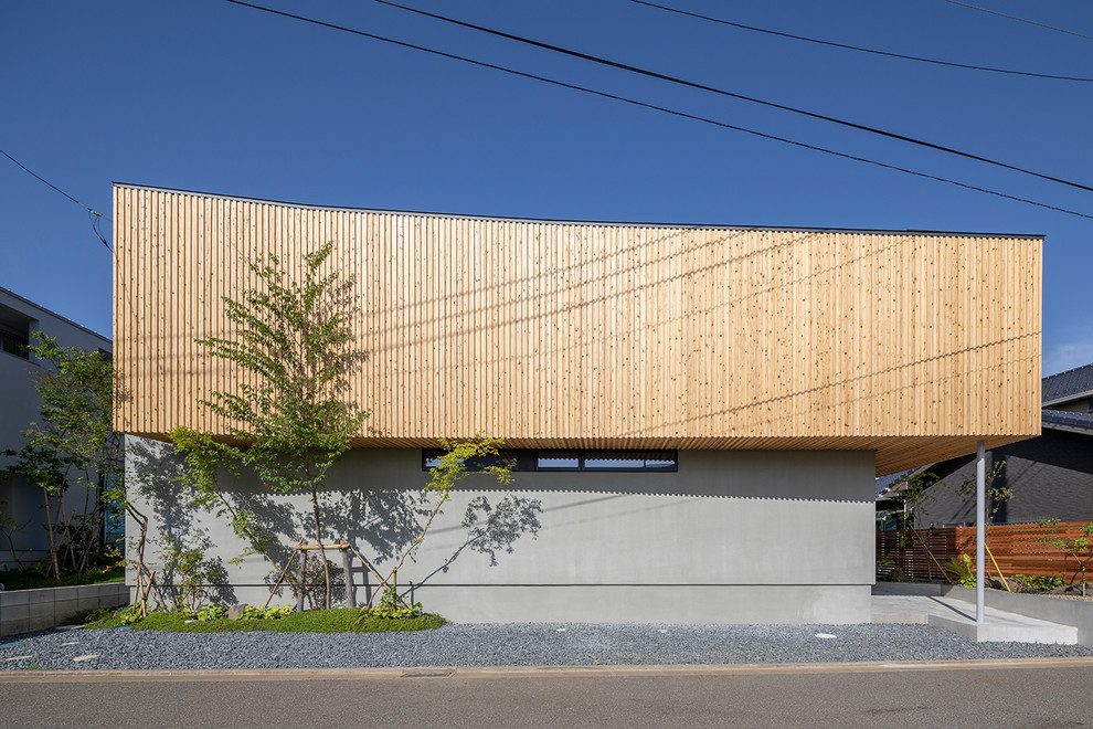 他の地域にあるコンテンポラリースタイルのおしゃれな家の外観 (マルチカラーの外壁) の写真