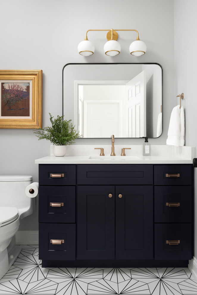 Inspiration for a mid-sized transitional white tile and porcelain tile porcelain tile, white floor and single-sink bathroom remodel in Chicago with shaker cabinets, blue cabinets, gray walls, an undermount sink, quartz countertops, a hinged shower door, white countertops and a freestanding vanity