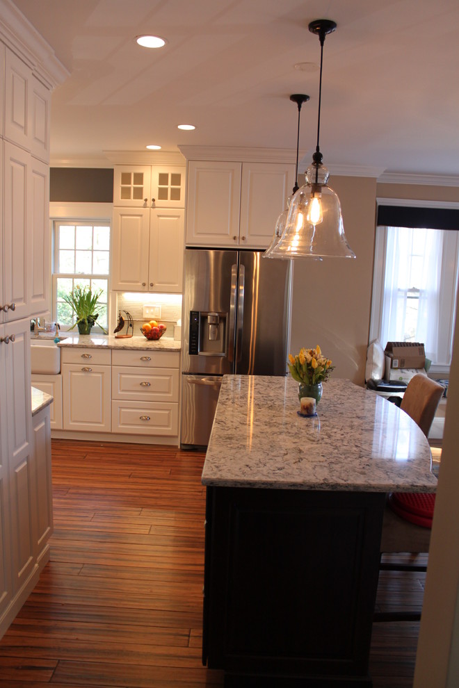 This is an example of a mid-sized traditional kitchen in Boston.