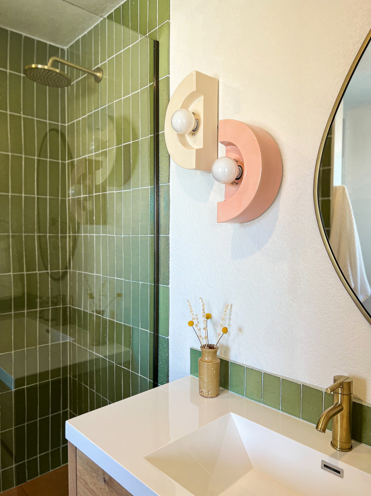 Photo of a contemporary master bathroom in Los Angeles with flat-panel cabinets, light wood cabinets, green tile, stone tile, beige walls, ceramic floors, an undermount sink, engineered quartz benchtops, pink floor, an open shower, white benchtops, a single vanity and a floating vanity.