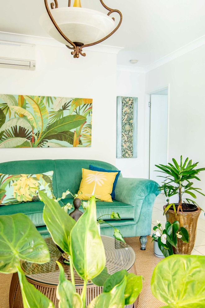 This is an example of a mid-sized tropical living room in Cairns.